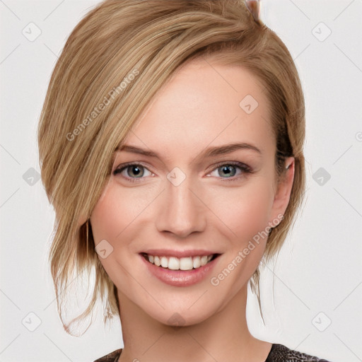 Joyful white young-adult female with medium  brown hair and blue eyes