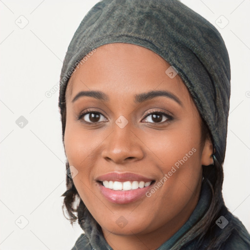 Joyful white young-adult female with long  black hair and brown eyes