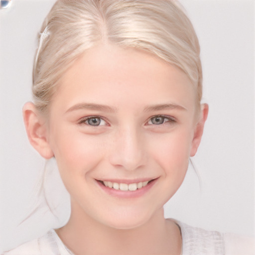 Joyful white child female with short  blond hair and blue eyes