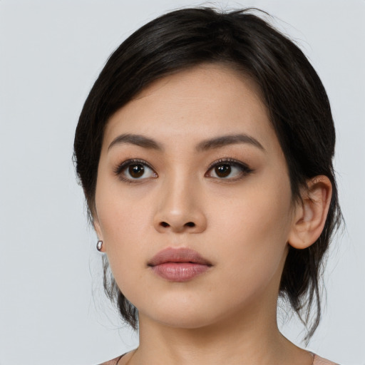 Neutral asian young-adult female with medium  black hair and brown eyes