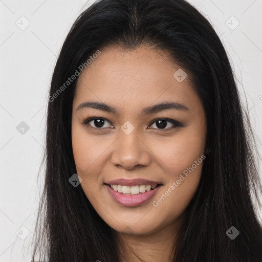 Joyful asian young-adult female with long  brown hair and brown eyes