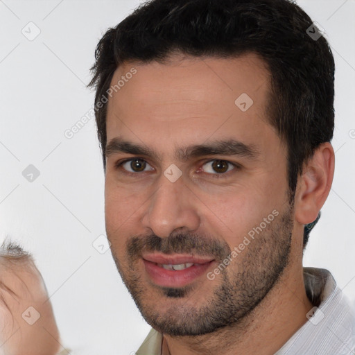 Joyful white young-adult male with short  brown hair and brown eyes