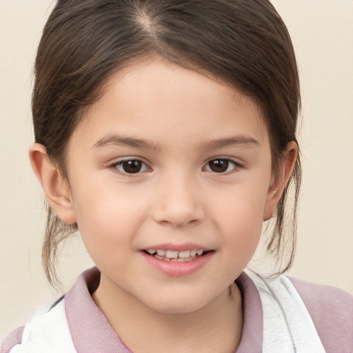 Joyful white child female with medium  brown hair and brown eyes