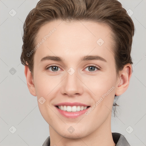 Joyful white young-adult female with short  brown hair and grey eyes