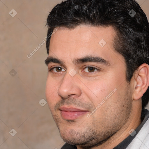 Joyful white young-adult male with short  black hair and brown eyes