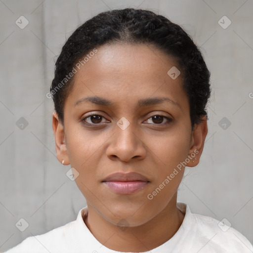 Joyful black young-adult female with short  black hair and brown eyes