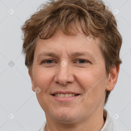 Joyful white adult female with short  brown hair and brown eyes