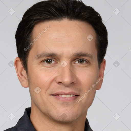 Joyful white adult male with short  brown hair and brown eyes