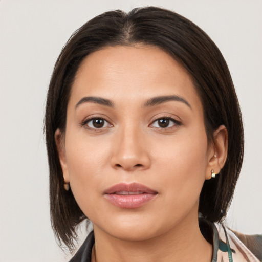 Joyful white young-adult female with medium  brown hair and brown eyes