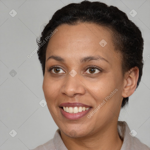 Joyful black young-adult female with short  brown hair and brown eyes