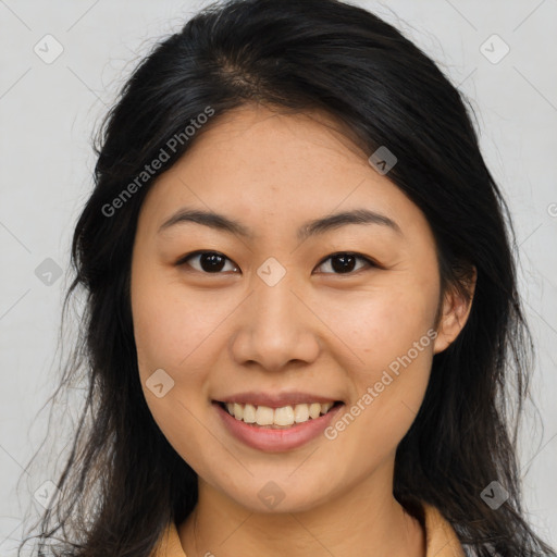 Joyful asian young-adult female with long  brown hair and brown eyes