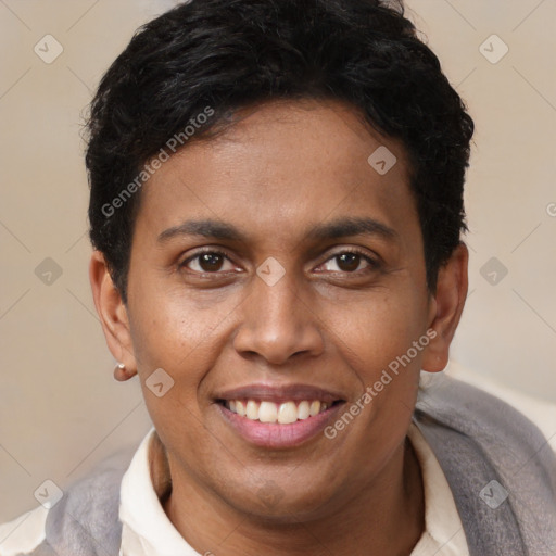 Joyful latino young-adult male with short  brown hair and brown eyes