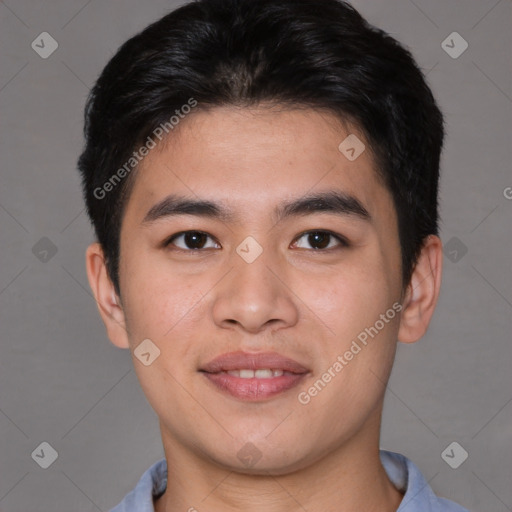 Joyful asian young-adult male with short  brown hair and brown eyes