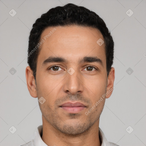 Neutral latino young-adult male with short  black hair and brown eyes