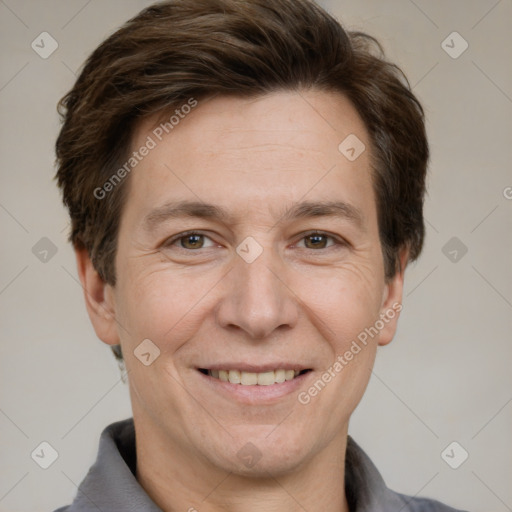 Joyful white adult male with short  brown hair and grey eyes