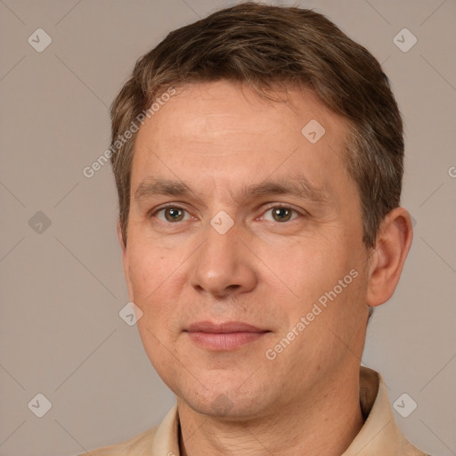 Joyful white adult male with short  brown hair and brown eyes