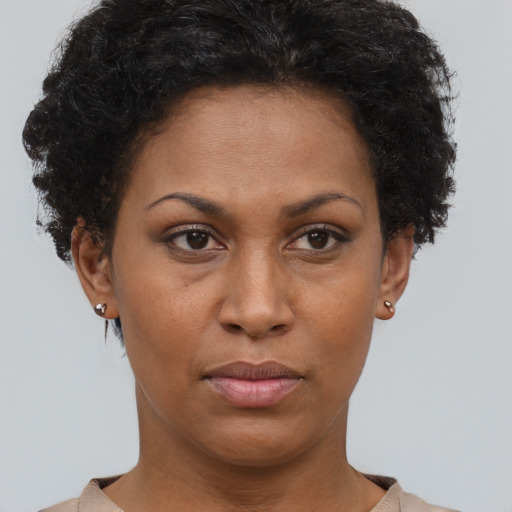 Neutral black adult female with short  brown hair and brown eyes