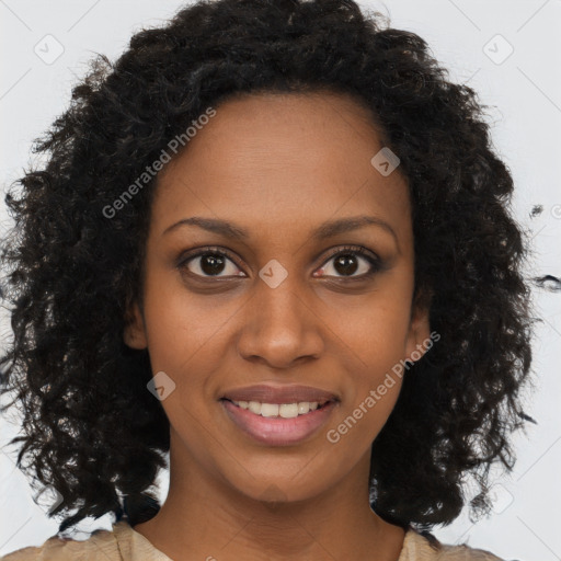 Joyful black young-adult female with long  brown hair and brown eyes