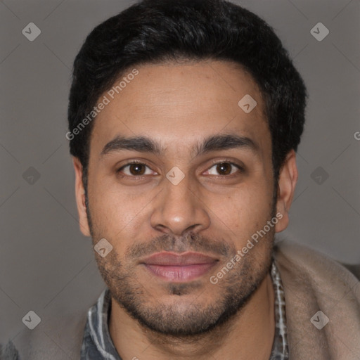 Joyful latino young-adult male with short  black hair and brown eyes