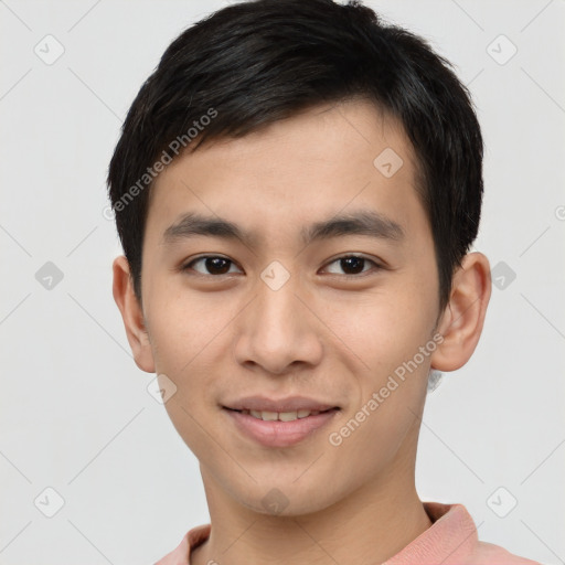 Joyful asian young-adult male with short  brown hair and brown eyes