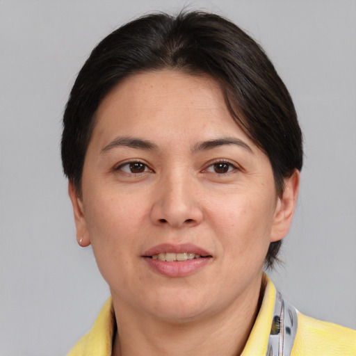 Joyful white adult female with medium  brown hair and brown eyes