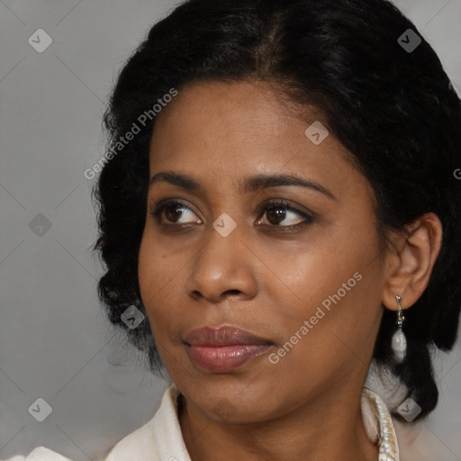 Joyful black young-adult female with medium  brown hair and brown eyes