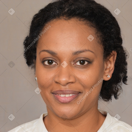 Joyful black young-adult female with medium  brown hair and brown eyes