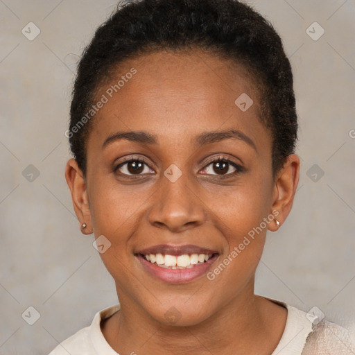 Joyful black young-adult female with short  brown hair and brown eyes