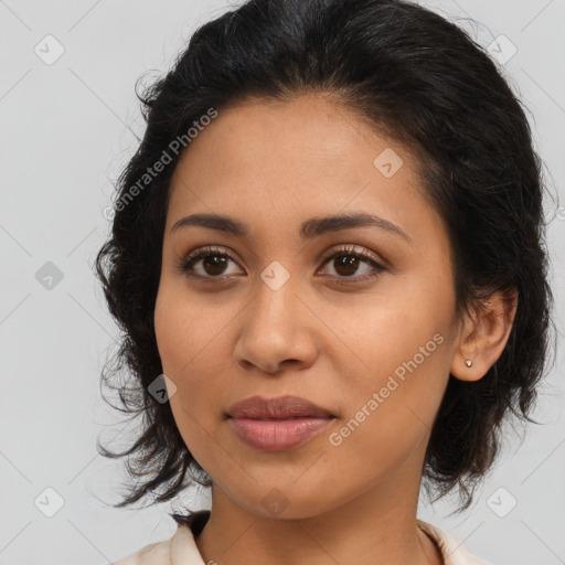 Joyful latino young-adult female with long  brown hair and brown eyes