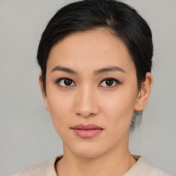 Neutral asian young-adult female with medium  brown hair and brown eyes