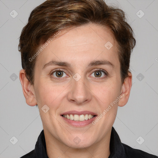 Joyful white young-adult female with short  brown hair and grey eyes