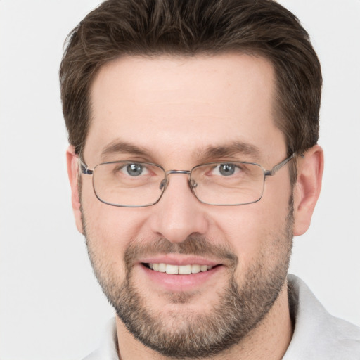 Joyful white adult male with short  brown hair and grey eyes