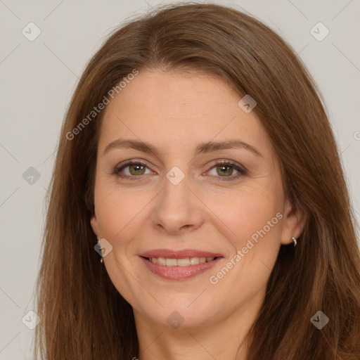 Joyful white adult female with long  brown hair and brown eyes