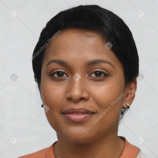 Joyful latino young-adult female with short  black hair and brown eyes