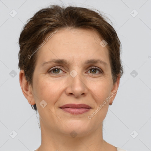 Joyful white adult female with short  brown hair and grey eyes