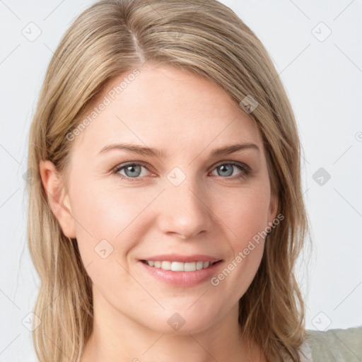 Joyful white young-adult female with long  brown hair and blue eyes