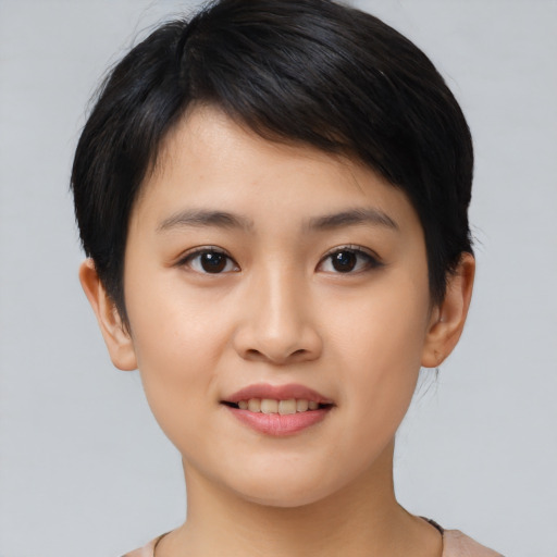 Joyful asian young-adult female with short  brown hair and brown eyes