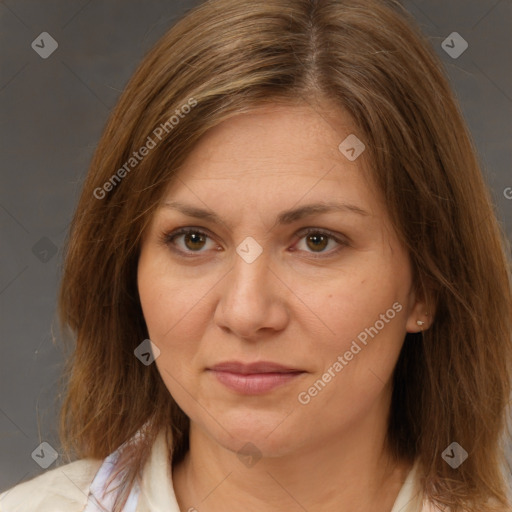 Joyful white adult female with medium  brown hair and brown eyes