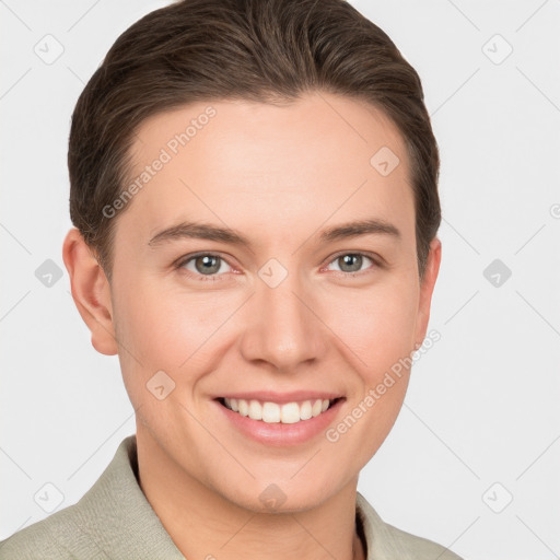 Joyful white young-adult female with short  brown hair and grey eyes