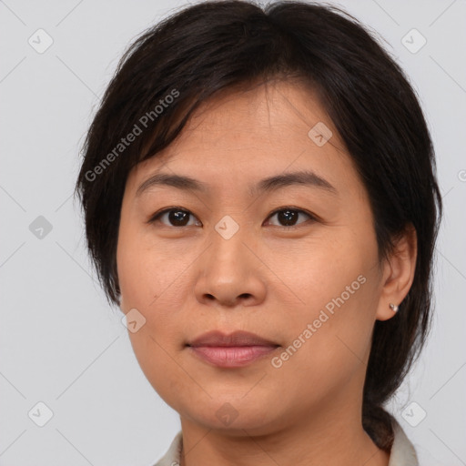 Joyful asian young-adult female with medium  brown hair and brown eyes