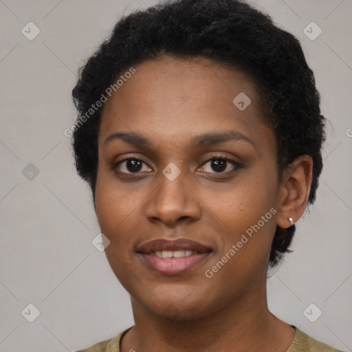 Joyful black young-adult female with short  brown hair and brown eyes