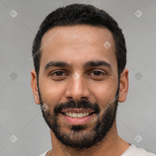 Joyful white young-adult male with short  black hair and brown eyes