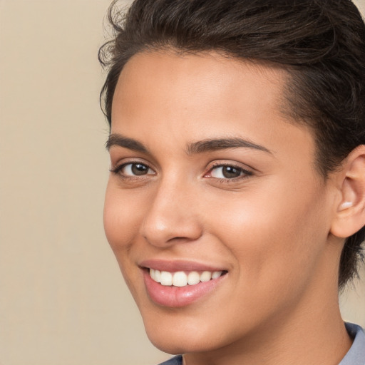 Joyful white young-adult female with medium  brown hair and brown eyes