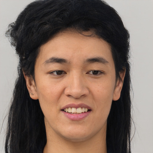 Joyful asian young-adult female with long  black hair and brown eyes