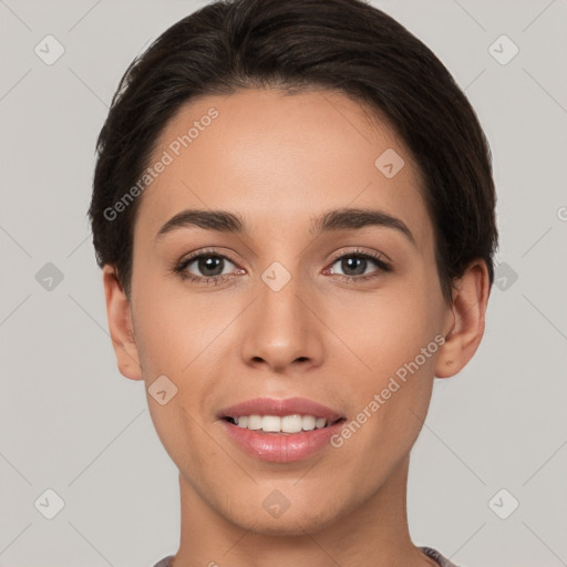 Joyful white young-adult female with short  brown hair and brown eyes