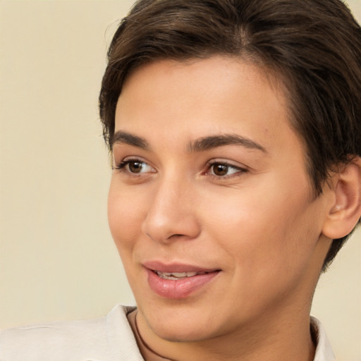 Joyful white young-adult female with short  brown hair and brown eyes