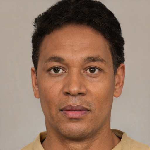 Neutral latino adult male with short  brown hair and brown eyes