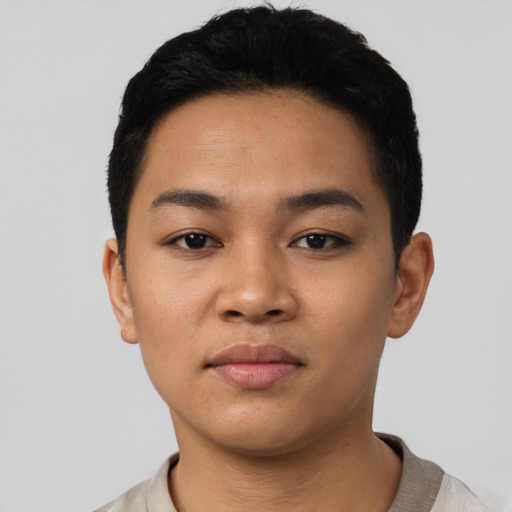Neutral latino young-adult male with short  black hair and brown eyes