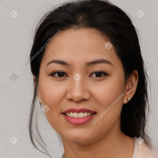 Joyful asian young-adult female with medium  brown hair and brown eyes