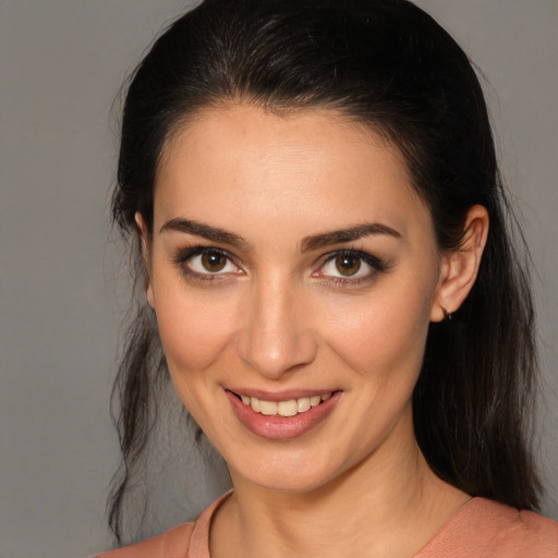 Joyful white young-adult female with medium  brown hair and brown eyes